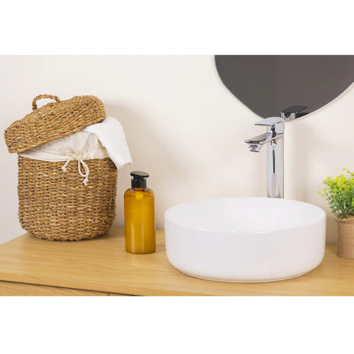 Chrome high rise basin mixer tap detail